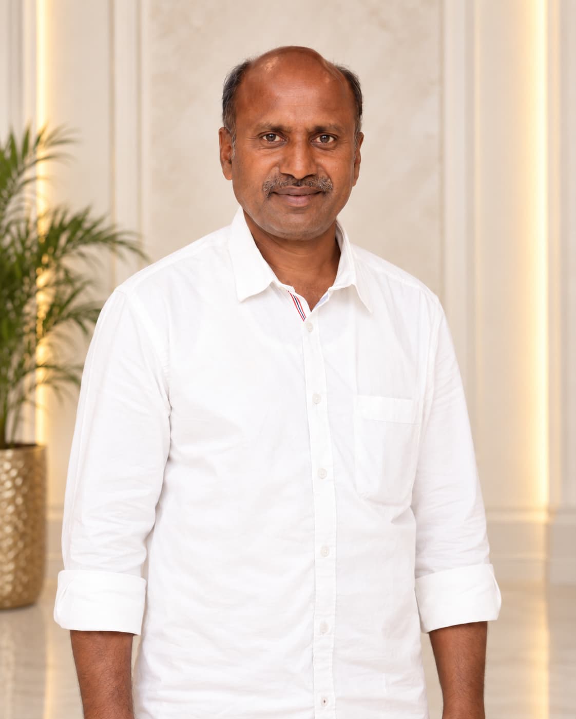 Kusakula Mohan Reddy, founder of Prasanna Venkateswara, wearing a white shirt